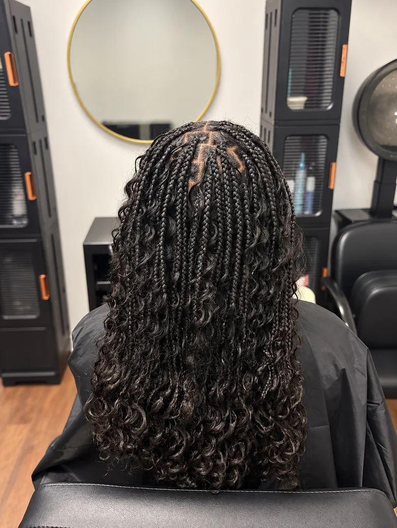Small knotless braids with curls left out at the crown